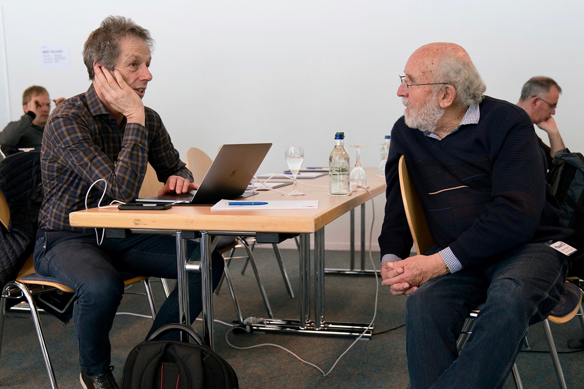 Willy Benz (left) in discussion with Michel Mayor (right) at the General Assembly of the NCCR PlanetS. Photo: Sylviane Blum